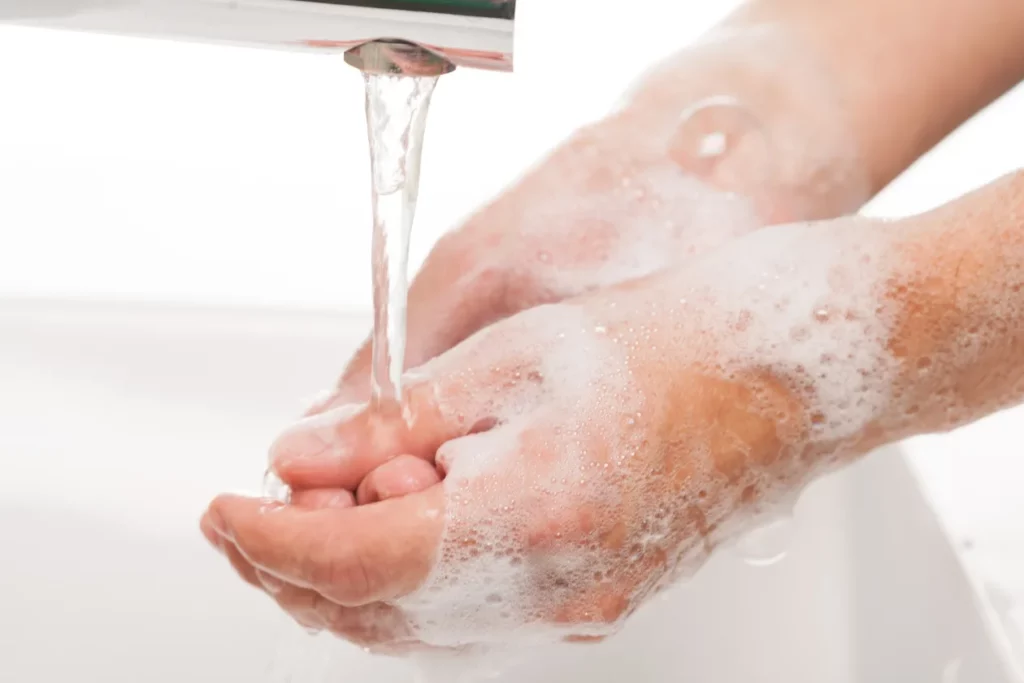 Washing hands with foam hand soap