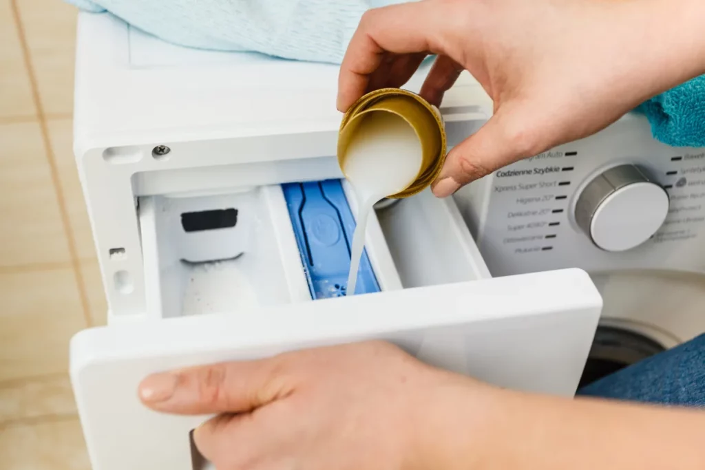 Dosing liquid detergent into a washer