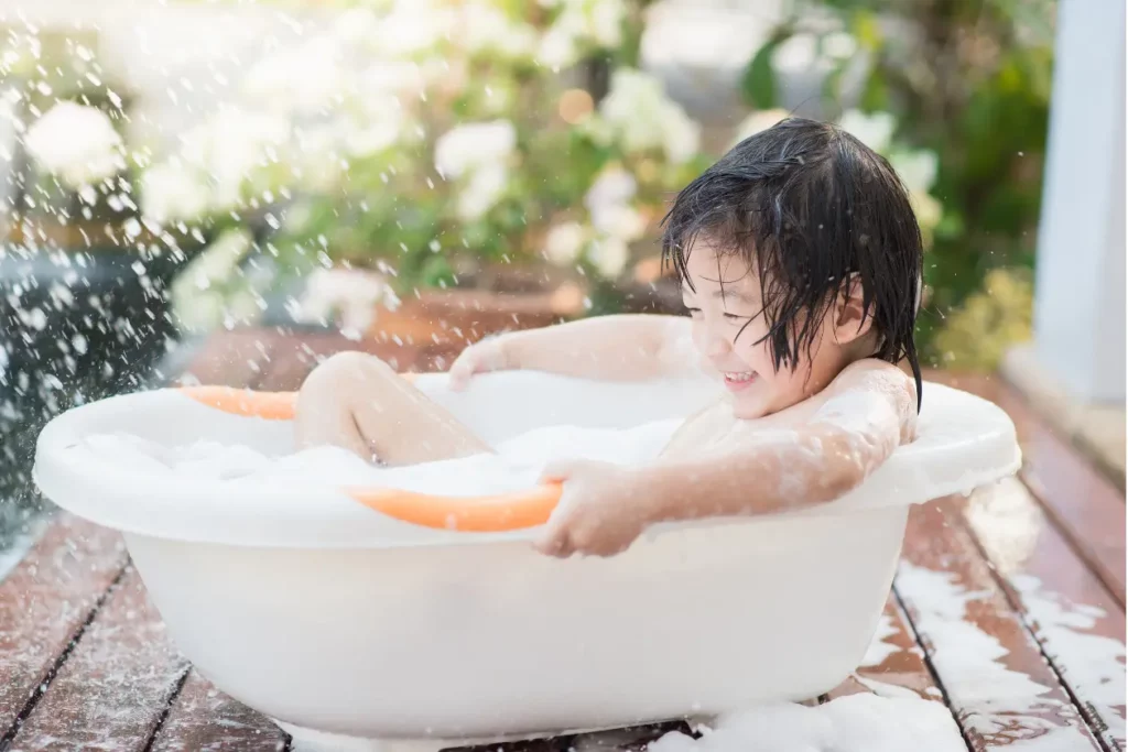 Baby taking bubble bath